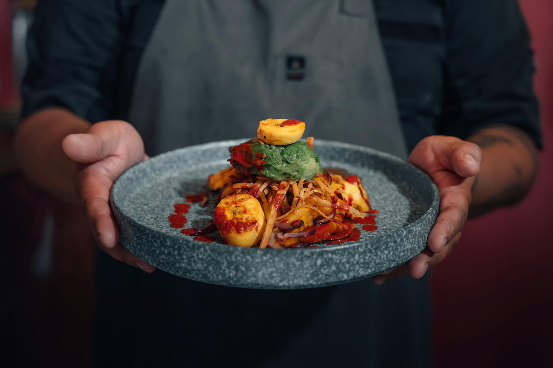 man hands holding plate of food