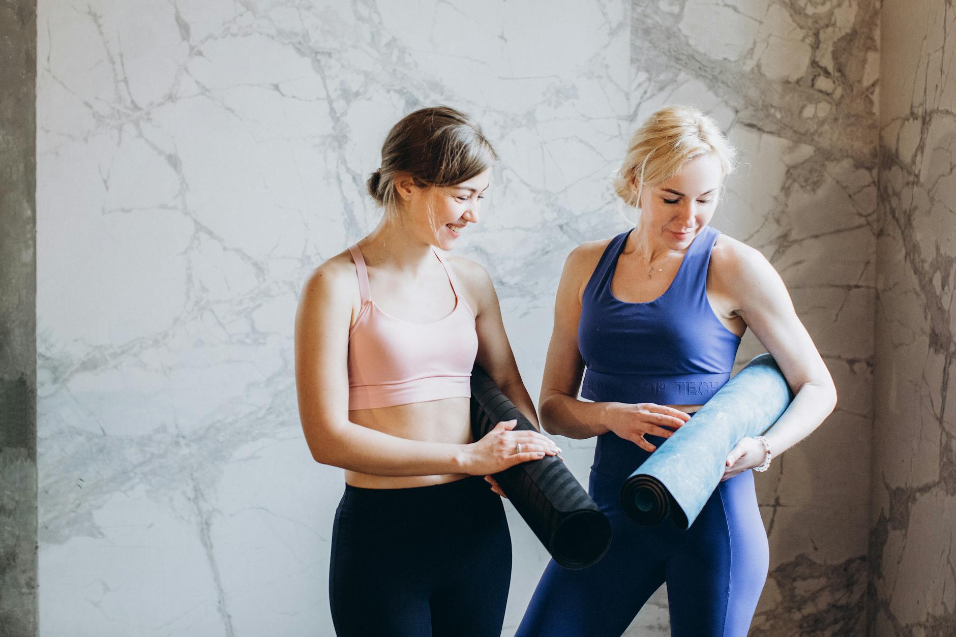 women comparing yoga mats